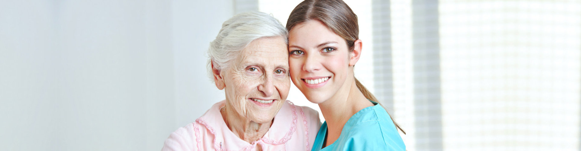 happy caregiver and senior woman