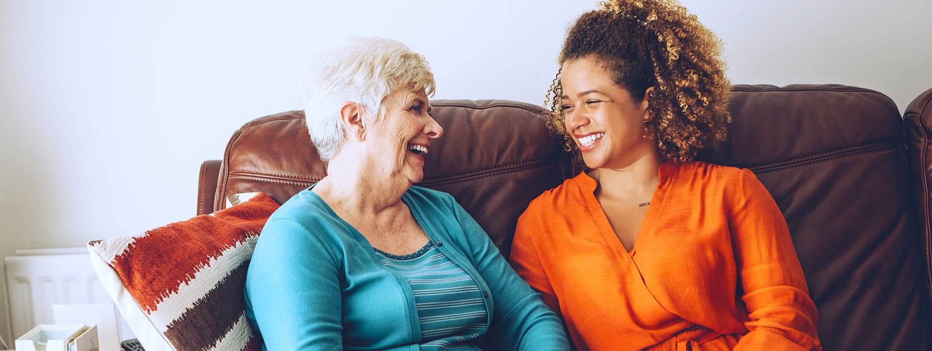 a picture of caregiver and a senior smiling