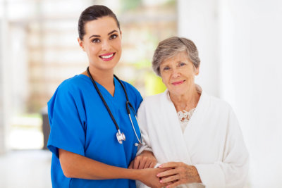 senior women and caring young nurse