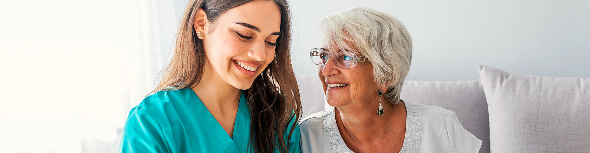 happy patient is holding caregiver for a hand while spending time together